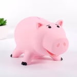 Tirelire cochon rose qui sourit