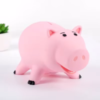 Tirelire cochon rose qui sourit