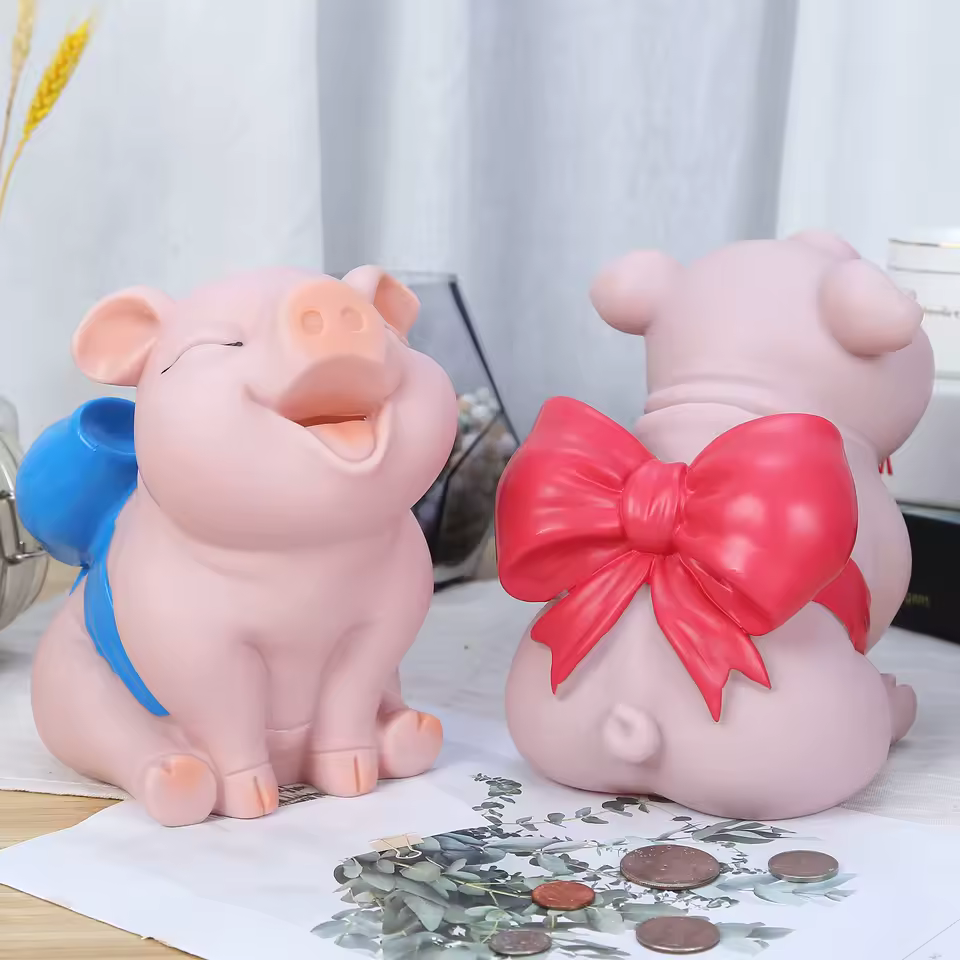 Tirelire cochon avec noeud papillon bleu
